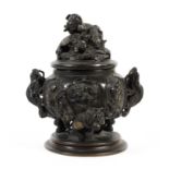 A Chinese 19th century bronze censer and cover.