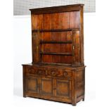 An 18th century elm dresser.