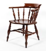 A 19th century elm smokers/captains chair.