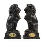 A pair of 19th century cast iron lion door stops.