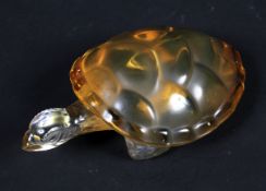 A Lalique amber tinted glass model of a turtle.