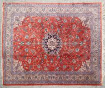 A 20th century wool Persian style carpet.