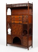 An Edwardian mahogany four sectioned cabinet of Moorish influence.