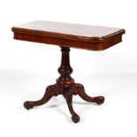 A Victorian mahogany fold over swivel top tea table.