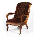 A Victorian mahogany framed upholstered button back parlour elbow chair.