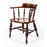 A 19th century stained elm smoker's bow chair/captains chair.