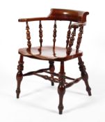 A 19th century stained elm smoker's bow chair/captains chair.