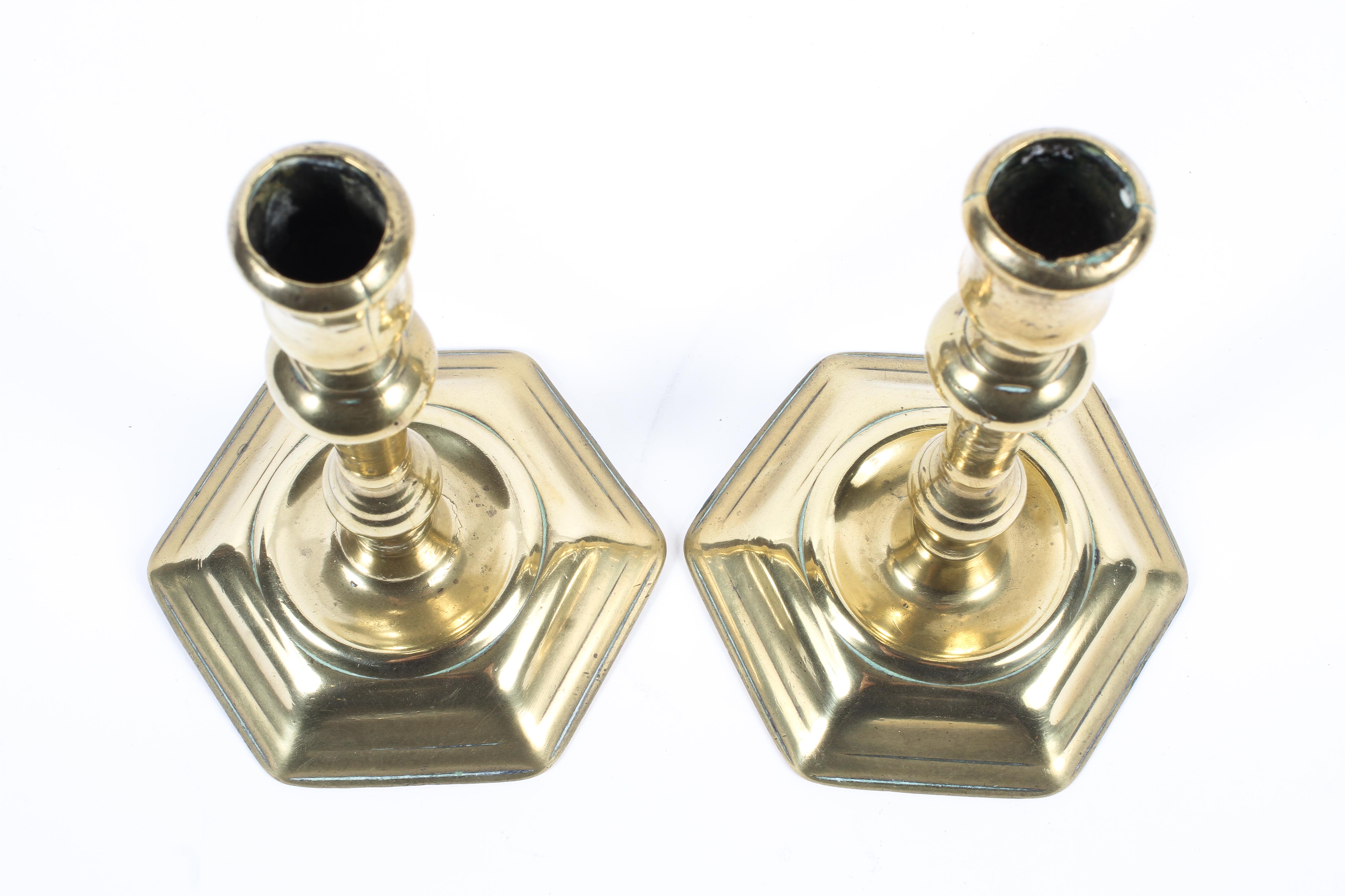 A pair of Georgian seamed brass candlesticks. - Image 2 of 2