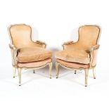 Pair of 20th century French fauteuil cream painted elbow chairs.