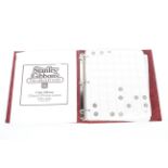 A collectors coin album containing a variety of British coinage.