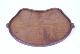 An oak kidney shaped Mouseman tray. with two mice handles L47cm.