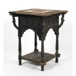 A 19th century Anglo-Indian profusely carved table of square form.
