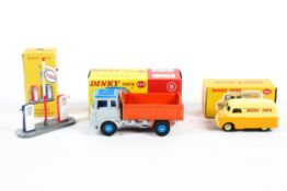 Three modern Dinky Atlas Edition diecast models.