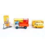 Three modern Dinky Atlas Edition diecast models.