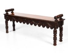 A Victorian stained carved oak window seat.