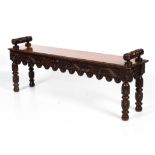 A Victorian stained carved oak window seat.