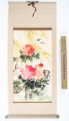 A Chinese scroll painting. Painted with pink peonies and foliage in watercolour on paper.