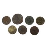 Six 17th century farthings and one half penny,