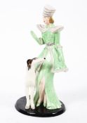 A Crown Devon Art Deco figure of a lady with a greyhound.