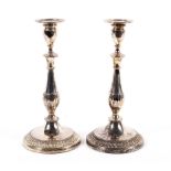 A pair of Viners of Sheffield silver plated candlesticks.