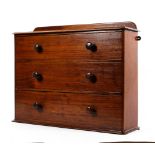 A Victorian mahogany hanging chest of drawers With three drawers with turned wooden handles,