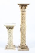 Two cream coloured resin pedestal Corinthian columns in sizes.