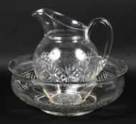 A late 19th century cut glass water ewer and basin.