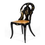 A Victorian black lacquered and mother of pearl inlaid chair.