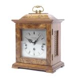 A burr walnut bracket clock by Thwaites & Reed (London).