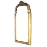 A 19th century arched top gilt wooden framed wall mirror.