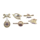 A collection of five early 20th century military sweetheart brooches.