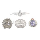 Three silver military sweetheart brooches and a white metal example.