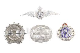 Three silver military sweetheart brooches and a white metal example.