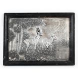 A white metal silvered plaque of a Roe buck and a Doe in a forest setting. Framed, L40.