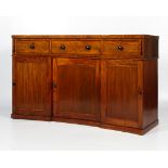 An early 19th century mahogany concave shaped sideboard.