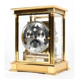 A Kieninger 8-day moonphase gilt-metal triple chime mantel clock.