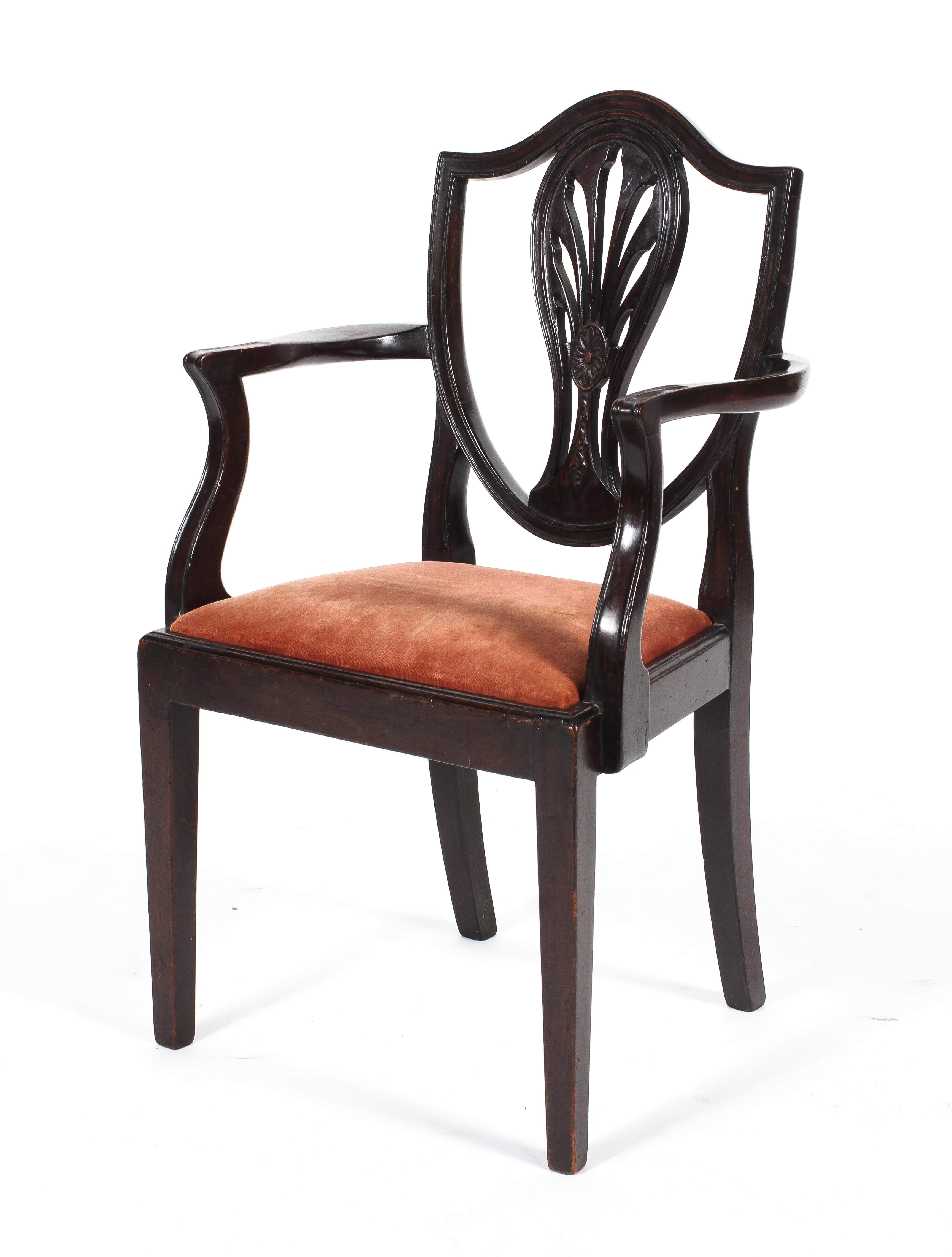 A 19th century mahogany Hepplewhite shield back child's carver chair.