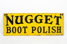 A 'Nugget Boot Polish' enamel advertising sign.