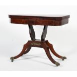 A Regency rosewood fold over brass inlaid card table.