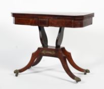 A Regency rosewood fold over brass inlaid card table.