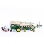 Three Ertl 1:16 scale diecast models.