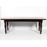A late Victorian varnished mahogany refectory dining table.