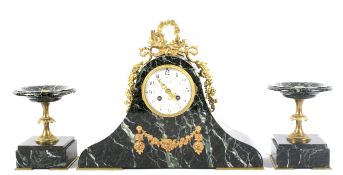 A French late 19th century marble and gilt-metal mounted three piece clock garniture.