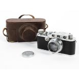 A Leica DRP 35mm range finder camera with lens and original leather case.