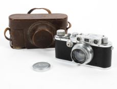 A Leica DRP 35mm range finder camera with lens and original leather case.