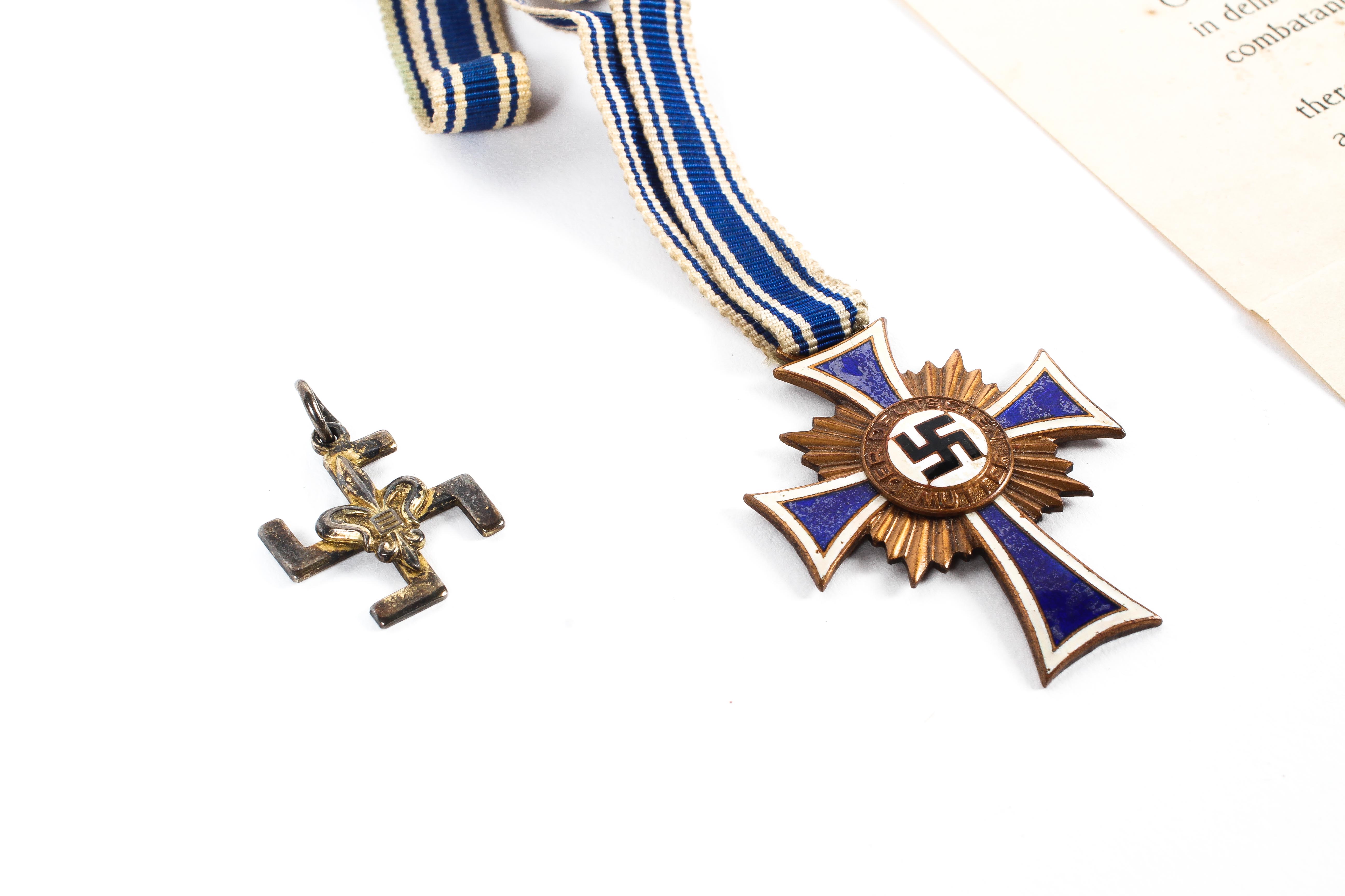 A WWII German Third Reich enamel 'Der Deutschen Mutter' mothers medal and other items. - Image 3 of 3