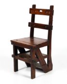 A Victorian mahogany Gothic style metamorphic chair.