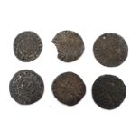 Six hammered pennies