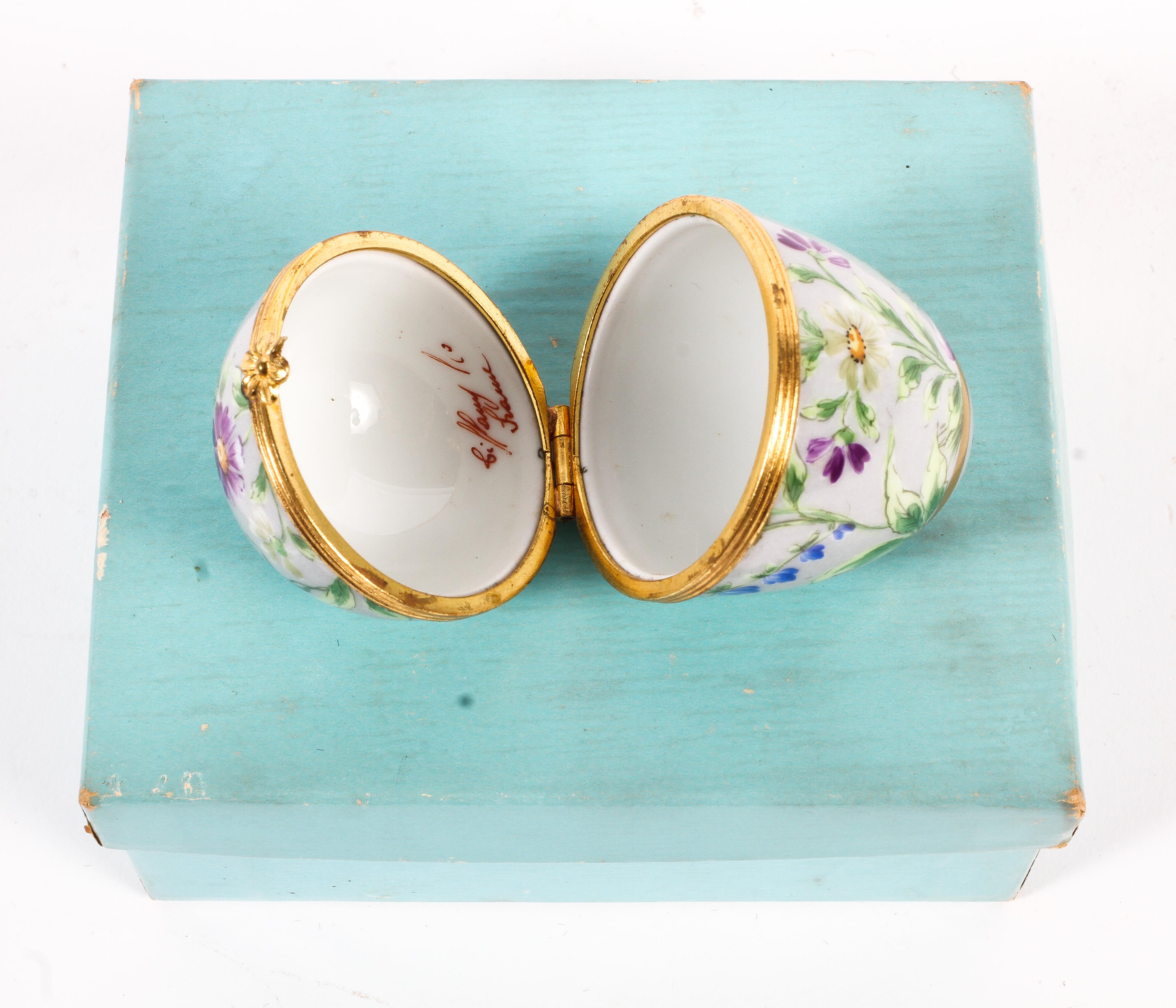 A Tiffany & Co gilt-metal mounted porcelain egg. - Image 2 of 2