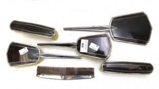 An Art Deco six piece silver dressing table set by Adie Brothers Ltd.